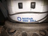 a machine that is sitting on top of a pile of dirt
