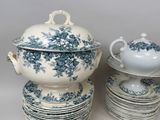 a lot of plates and bowls with blue flowers on them