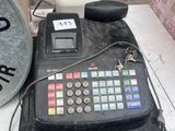 an image of a cash register and other items on a table
