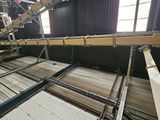 a machine that is working on the floor of a factory
