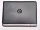 a close up of a laptop on a white surface