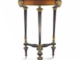 a small table with a marble top and two legs