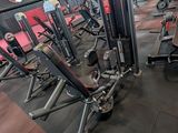 a large gym with a lot of machines in it