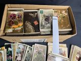 a box full of old postcards sitting on a table