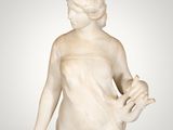 an image of a statue of a woman holding a flower