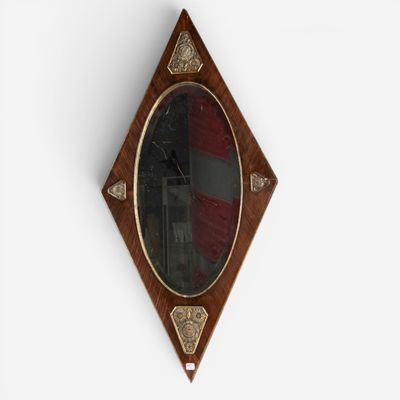 a mirror hanging on the wall with a flag in the background