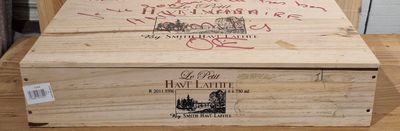 a wooden box that has some writing on it