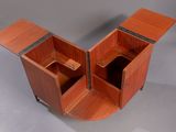 an image of a wooden cabinet with two doors open