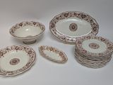 many plates and bowls that are sitting on a table