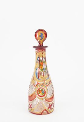 a glass bottle with a red and yellow design on it