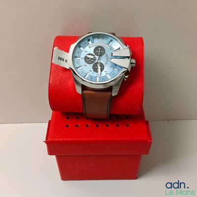 a watch that is sitting on top of a red box