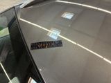 a sticker on the hood of a car that has a sticker on it