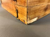 a wooden box that has a handle on it