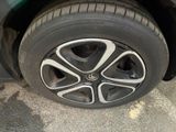 a close up of a tire on a car ' s rim