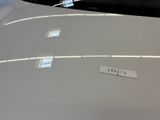 a sticker on the hood of a white car