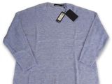 a blue sweater with a black label on it