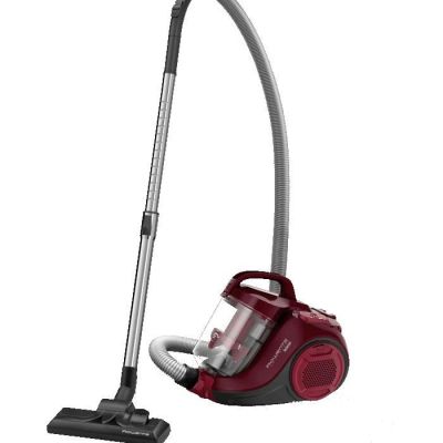 a red vacuum cleaner is sitting on a white surface