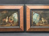 two framed paintings of a man and a woman in a stable