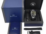 a watch in a blue box with a black strap