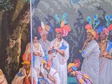 painting of a group of people playing a game in a forest