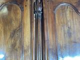 a close up of a wooden door with a handle on it