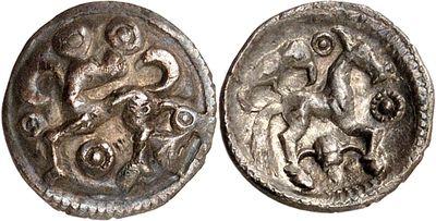 a silver coin with an image of a horse and a man on it