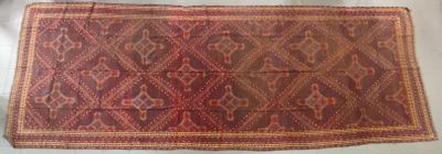 an image of a red and brown rug on a white surface