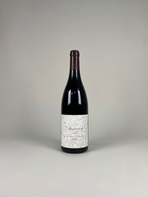 a bottle of wine that is sitting on a table