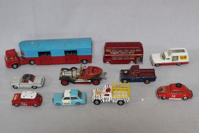 a lot of toy cars and trucks that are on a table