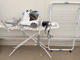 a ironing board and a dryer sitting on top of an ironing board