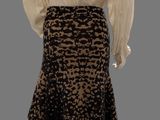 a mannequin dress with a white blouse and black skirt