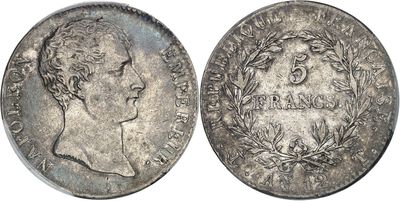 a close up of a silver coin with a man ' s face on it