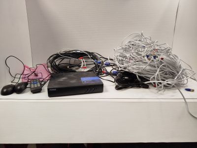 a white shelf with a bunch of wires on top of it