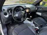 the interior of a small car with black seats and a steering wheel