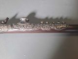 a metal pipe with a bird on top of it