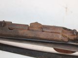a close up of a metal object on a white surface