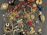 a pile of jewelry that is on a table