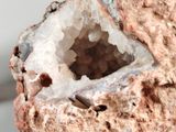 a small piece of rock with a hole in it