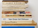 many books stacked on top of each other on a table