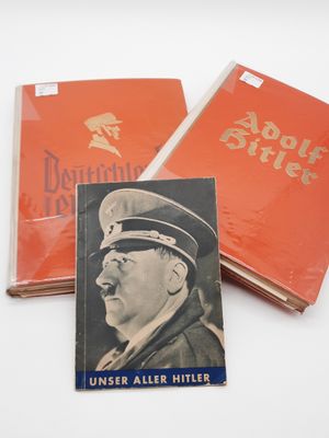 two books with a picture of a man in a military uniform and a book with a picture of a man in a military uniform and a book with a picture of