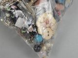 a bag of assorted buttons and other items in it