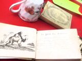 un livre ouvert posé sur une table rouge, à côté d'une tasse de café