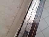 a close up of a piece of wood with a ruler on it
