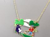 gold plated necklace with a picture of a man and a woman on a bench