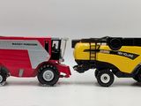 two toy tractors that are next to each other on a white surface