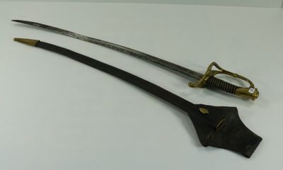 an old sword with a wooden handle on a white surface