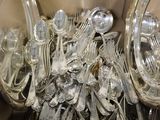a box full of silverware sitting on a table