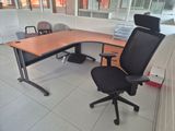 a desk with a chair and a computer monitor on it