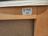 a picture of a close up of a bed with a label on it