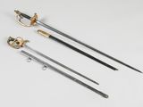 three swords and a sword on a white surface